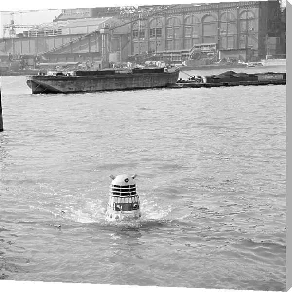 A Dalek emerges from the river Thames at the jetty near Battersea Church Road