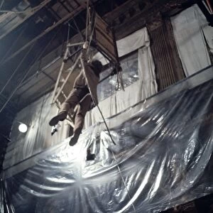 Donald Sutherland dangles from a rope in a scene from Don t Look Now (1973)
