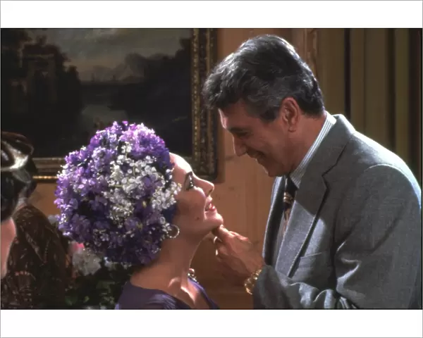 Elizabeth Taylor and Rock Hudson in a scene from The Mirror Crack d (1980)