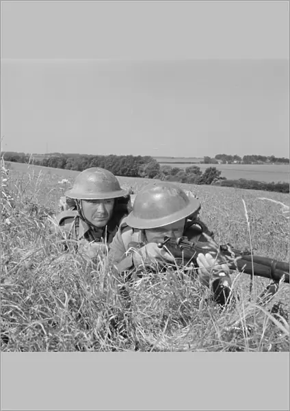 Corporal Bins and a comrade take aim in the countryside