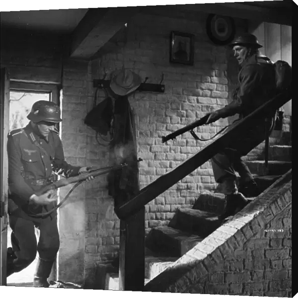 John Mills as Corporal Bins in close combat with a German Soldier