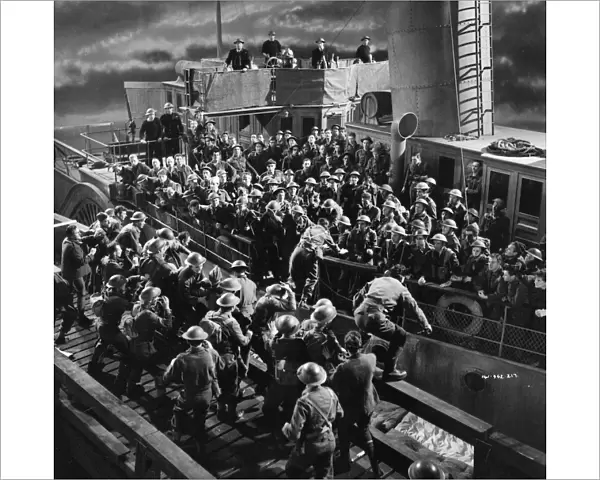 British soldiers board a ship at night