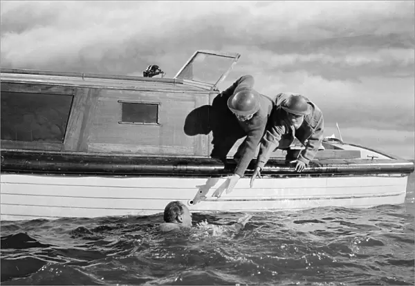 British soldiers in the water waiting to be rescued