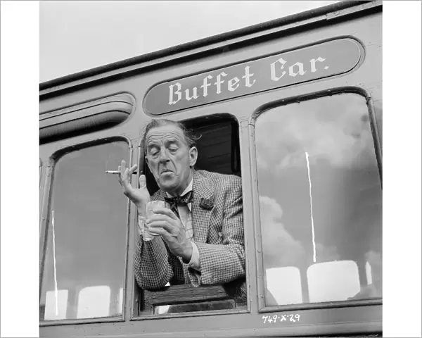 A drink by the window of the buffet car