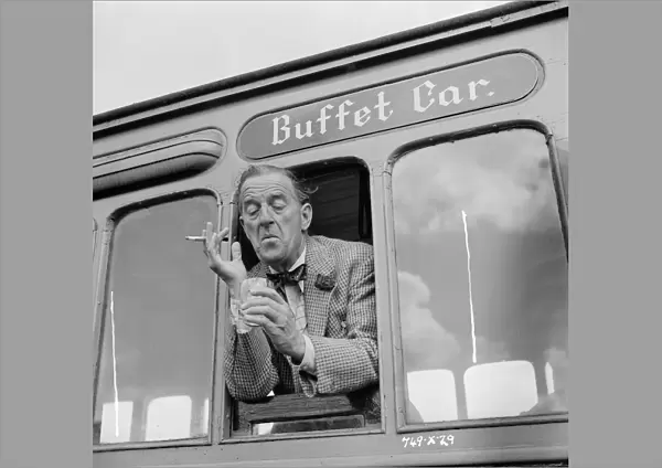 A drink by the window of the buffet car