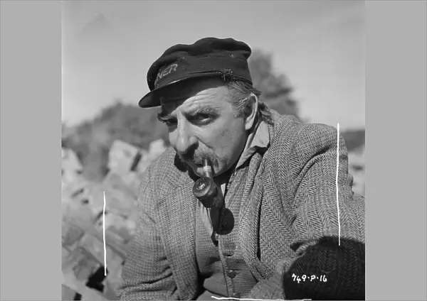 Hugh Griffith with pipe