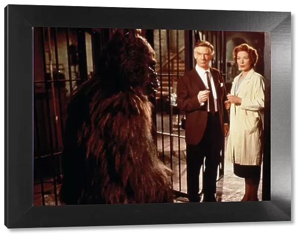 Konga in a cage with Dr. Decker and Margaret