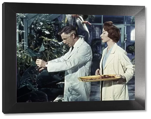 Dr Decker and Margaret feed the plants