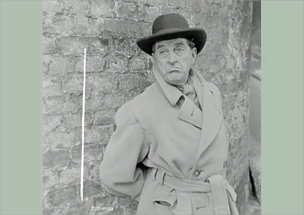 Stanley Holloway as Mr. Hollingsworth in Meet Mr. Lucifer (1953)
