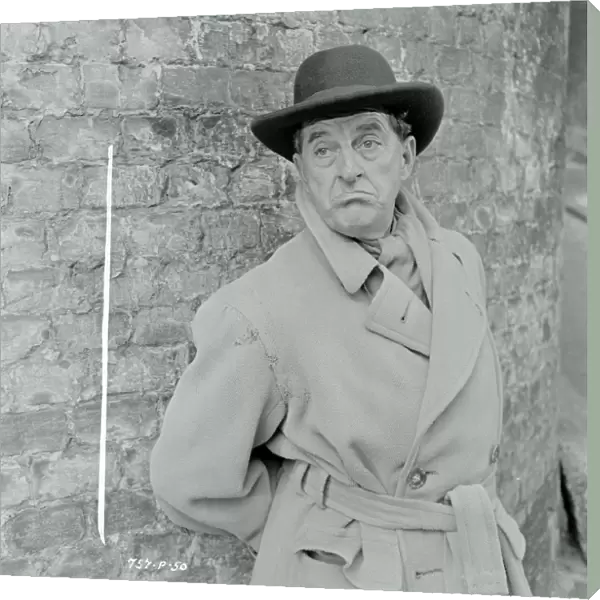 Stanley Holloway as Mr. Hollingsworth in Meet Mr. Lucifer (1953)