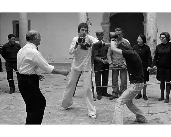 Jim and Mike boxing in the courtyard