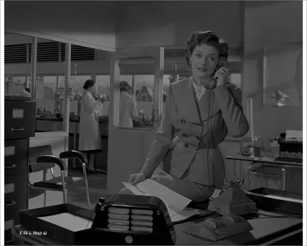 Helen Cherry on the phone in a scene from Young Wives Tale (1951)