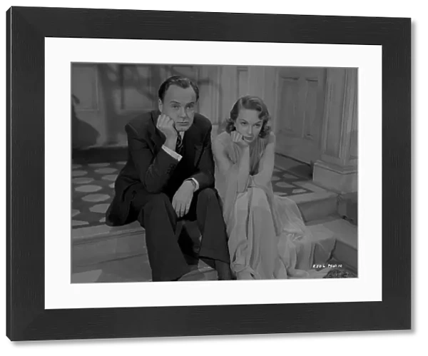Thoughtful Derek Farr and Joan Greenwood in a scene from Young Wives Tale