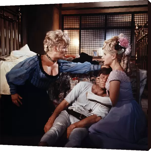 Joan Sims, Jim Dale and Angela Douglas in a scene from Carry On Cowboy