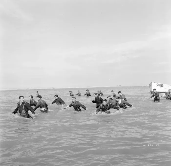 Framed Print : British troops walk into the water to try and board one of the small boats Framed Print : British troops walk into the water to try and board one of the small boats