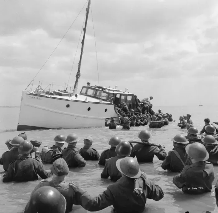 Framed Print : British troops walk into the water to try and board one of the small boats Framed Print : British troops walk into the water to try and board one of the small boats