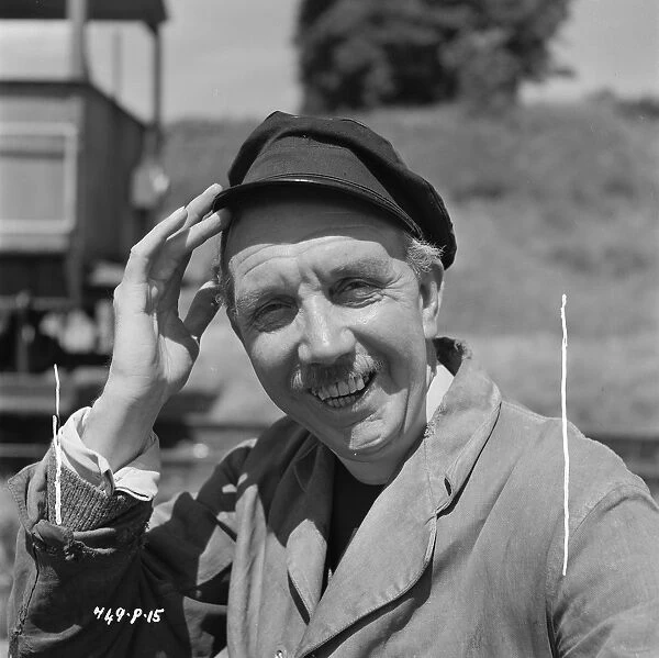 George Relph laughs. as the vicar in The Titfield Thunderbolt