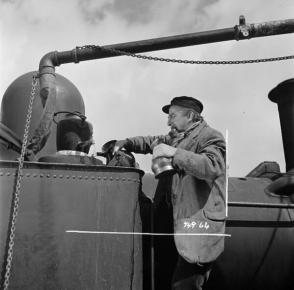 Hugh Griffith. as Dan working on the steam engine in The Titfield Thunderbolt