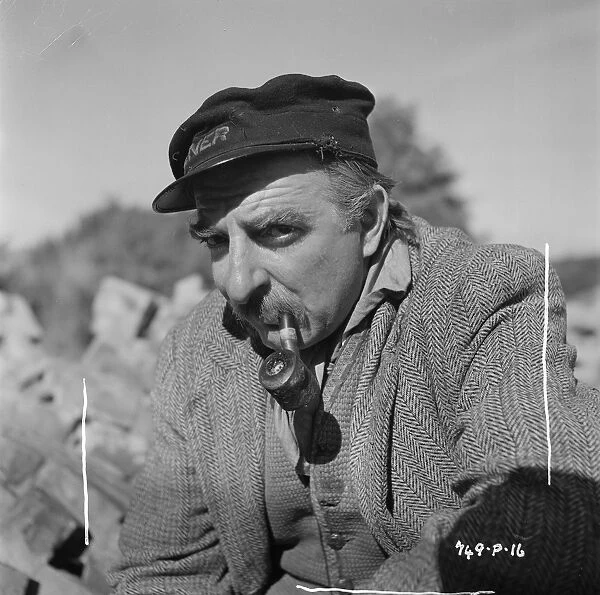 Hugh Griffith with pipe