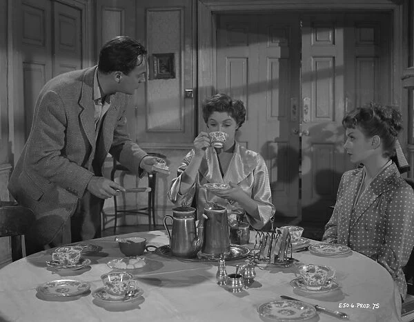 A production still image from Young Wives Tale (1951) set at the breakfast table