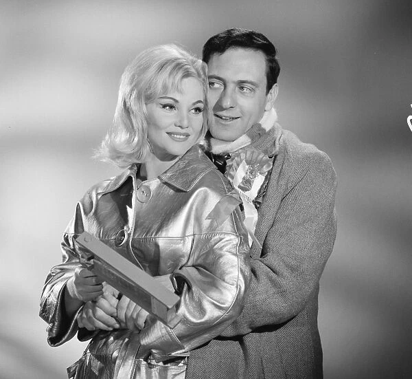 A publicity image for Rattle of a Simple Man (1964) taken on set at Elstree Studios