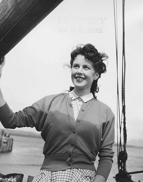 Sarah on the boat. in a scene from The Maggie (1954)