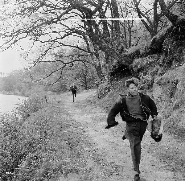 The wee boy runs. Tommy Kearins in a scene from the Maggie (1954)