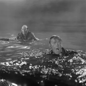 British soldiers in the water waiting to be rescued