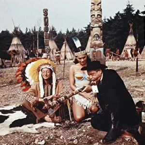 Charles Hawtrey, Sally Douglas and Sid James in a scene from Carry On Cowboy