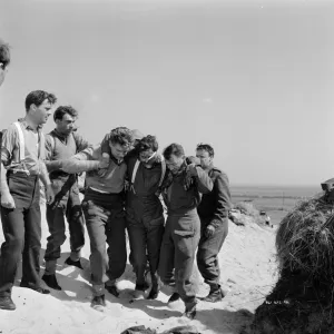 Corporal Tubby Bins helps the wounded