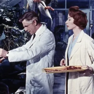 Dr Decker and Margaret feed the plants in a scene from Konga (1961) Print Dr Decker and Margaret feed the plants in a scene from Konga (1961) Print
