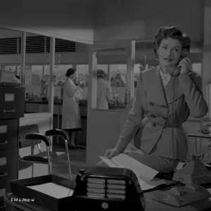 Helen Cherry on the phone in a scene from Young Wives Tale (1951)