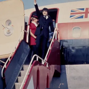 Jim MacLaine getting off a plane