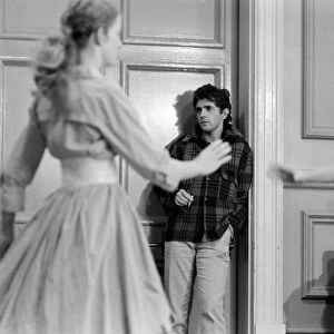 Jim MacLaine looks on a students dance