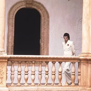 Jim MacLaine alone in his Spanish mansion