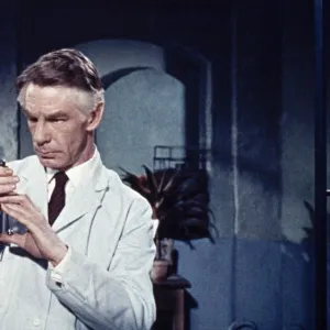 Michael Gough as Dr. Decker