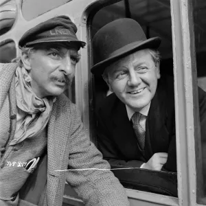 Naunton Wayne and Hugh Griffith smiling on set