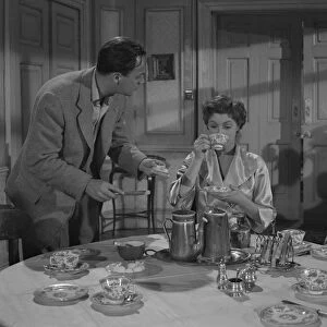 A production still image from Young Wives Tale (1951) set at the breakfast table