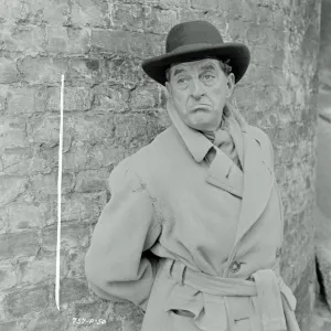 Stanley Holloway as Mr. Hollingsworth in Meet Mr. Lucifer (1953)