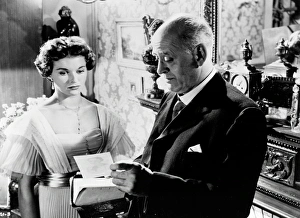 Alastair Sim and Eileen Moore in a scene from An Inspector Calls (1954)
