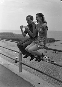 <b class=qtipBold><figcaption>Brighton Rock (1947)</figcaption></b><br>Richard Attenborough and Carol Marsh enjoy an ice cream on location.<br><em>© Copyright © Studiocanal Films Ltd</em> Brighton Rock (1947)