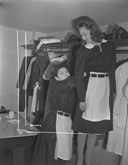 <b class=qtipBold><figcaption>Brighton Rock (1947) publicity</figcaption></b><br>An extra helps Carol Marsh with her waitress costume.<br><em>© Copyright © Studiocanal Films Ltd</em> Brighton Rock (1947) publicity