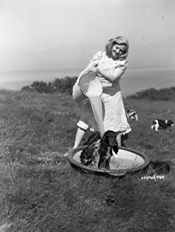 <b class=qtipBold><figcaption>Brighton Rock (1947) publicity</figcaption></b><br>Hermione Baddeley in a playful shot with one of her dogs.<br><em>© Copyright © Studiocanal Films Ltd</em> Brighton Rock (1947) publicity