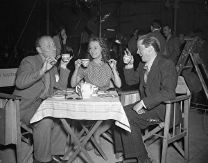 <b class=qtipBold><figcaption>Brighton Rock (1947) publicity</figcaption></b><br>William Hartnell, Carol Marsh and Richard Attenborough enjoy a playful cup of tea on set.<br><em>© Copyright © Studiocanal Films Ltd</em> Brighton Rock (1947) publicity