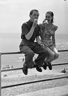 <b class=qtipBold><figcaption>Brighton Rock (1947) publicity</figcaption></b><br>Richard Attenborough and Carol Marsh enjoy an ice cream in a publicity walkabout to promote the filming of Brighton Rock.<br><em>© Copyright © Studiocanal Films Ltd</em> Brighton Rock (1947) publicity