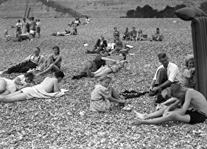<b class=qtipBold><figcaption>Brighton Rock (1947) publicity</figcaption></b><br>Richard Attenborough and Carol Marsh amongst sunbathers and families on Brighton beach.<br><em>© Copyright © Studiocanal Films Ltd</em> Brighton Rock (1947) publicity