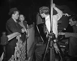 <b class=qtipBold><figcaption>Brighton Rock (1947) publicity</figcaption></b><br>John Boulting, Richard Attenborough and Carol Marsh discuss the set up of a night shot.<br><em>© Copyright © Studiocanal Films Ltd</em> Brighton Rock (1947) publicity