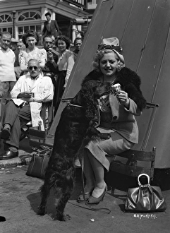 <b class=qtipBold><figcaption>Brighton Rock (1947) publicity</figcaption></b><br>Hermione Baddeley with one of her pet dogs in a pause from filming on the set of Brighton Rock.<br><em>© Copyright © Studiocanal Films Ltd</em> Brighton Rock (1947) publicity