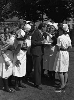 <b class=qtipBold><figcaption>Brighton Rock (1947) publicity</figcaption></b><br>Richard Attenborough jokes with a group of nurses during a pause from filming Brighton Rock.<br><em>© Copyright © Studiocanal Films Ltd</em> Brighton Rock (1947) publicity