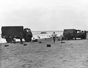 Danger Collection: Two British Army trucks stranded on the beach